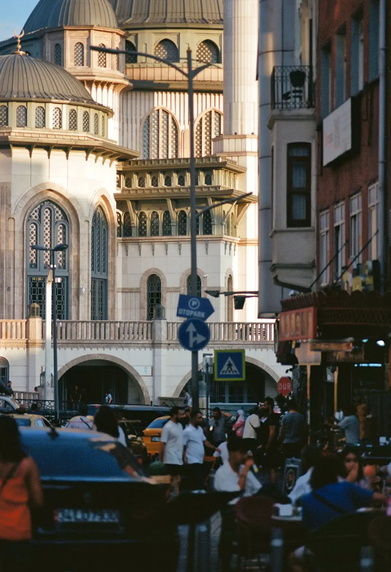 A busy pedestrianised street at dusk